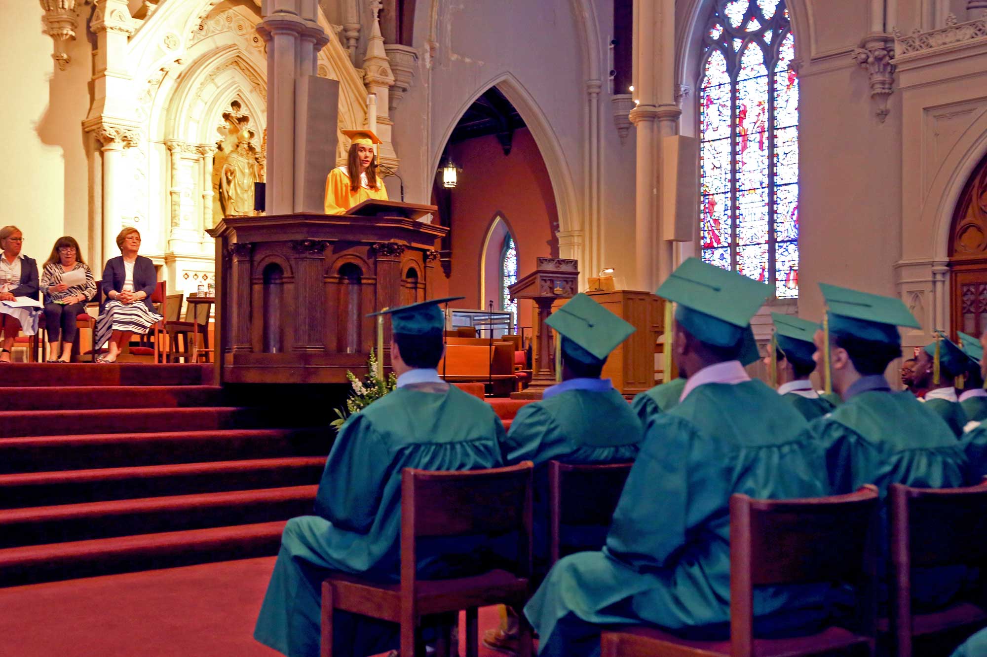 Class of 2016 Salutatorian, Taylor Driscoll, addresses her fellow graduates in the Cathedral of the Holy Cross at the Cathedral High School 86th Commencement Exercises on May 14, 2016