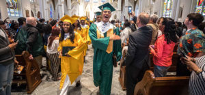 New Graduates Process out of the Cathedral of the Holy Cross at Graduation