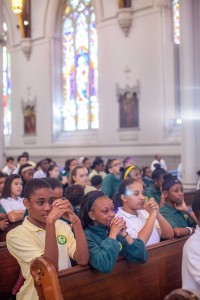 Cathedral students pray during the Mass of the Holy Spirit at the Cathedral of the Holy Cross Boston