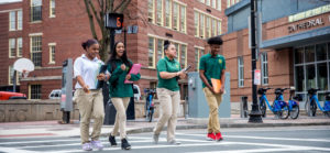 Students crossing a Boston City Street outside Cathedral High School in the South End